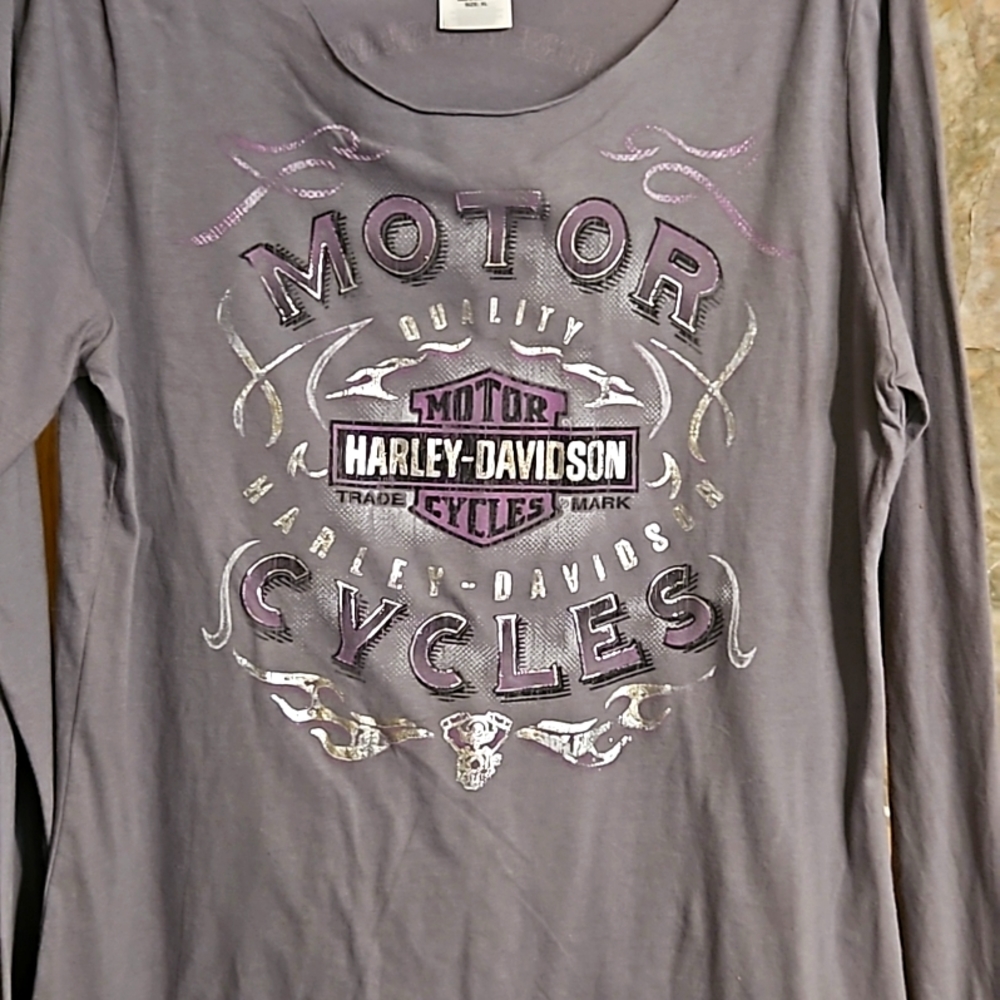 Grey with lavender accents & silver metal tone lettering.
